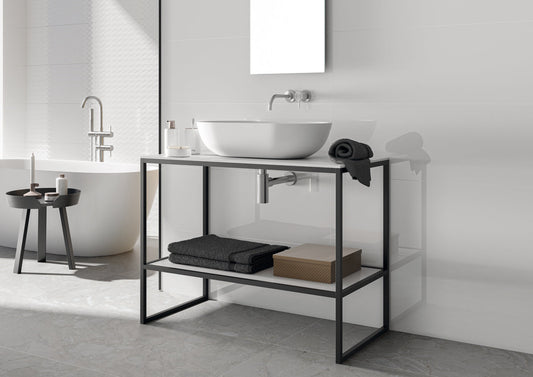 Bathroom with a black metal vanity unit, white sink, and towels.