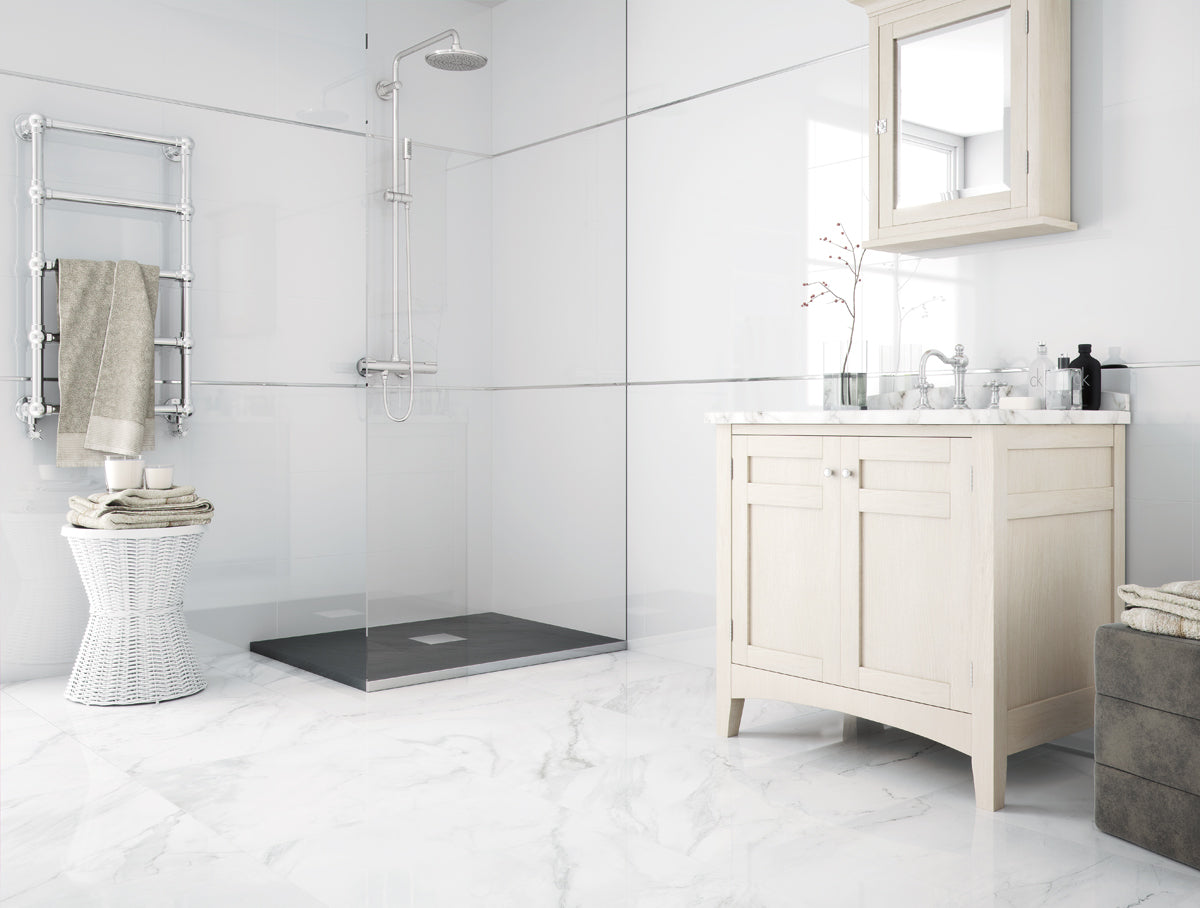 Modern bathroom with a toilet, shower, and vanity unit.