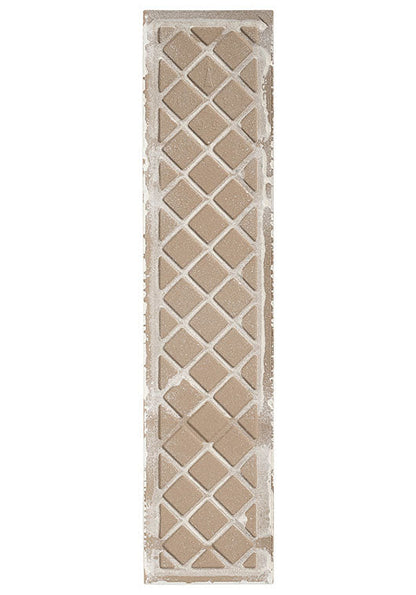 The back of a rectangular ceramic tile with a distressed lattice pattern, featuring a porcelain bisque and a white kiln release showing.