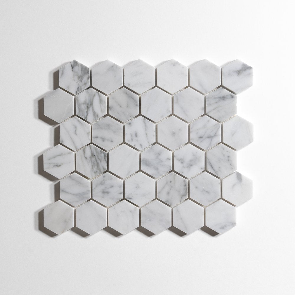Venatino Carrara honed hexagon marble mosaic on mesh sheet